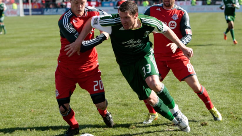 Kenny Cooper battles with Toronto defenders on Saturday.