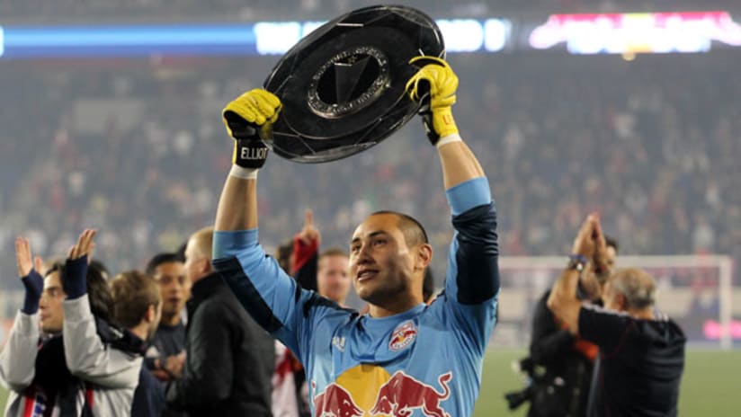 New York goalkeeper Luis Robles holds up the Supporters' Shield