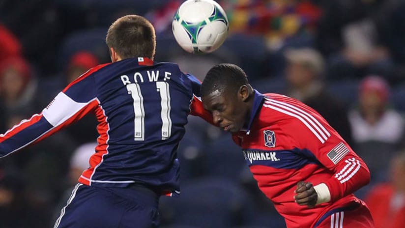 Kelyn Rowe, New England Revolution, outjumps Chicago Jalil Anibaba.