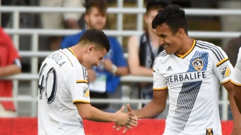 Jose Villarreal (right) and Raul Mendiola celebrate an LA Galaxy goal