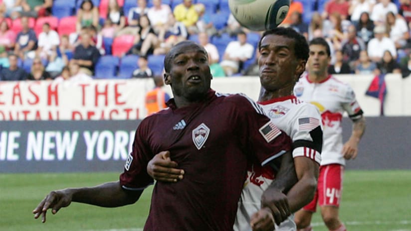 Colorado's Omar Cummings battles New York's Roy Miller for possession during the Red Bulls' 3-1 win on Saturday.