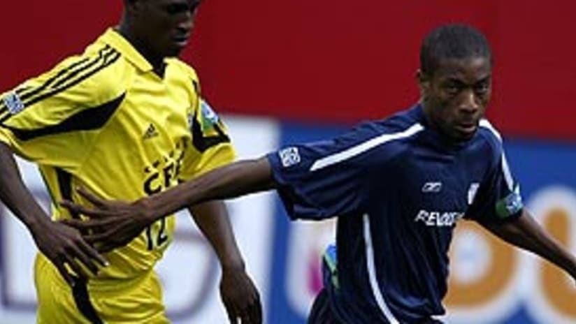 Edson Buddle (left) scored Saturday, but the Crew had to settle for a draw with New England.