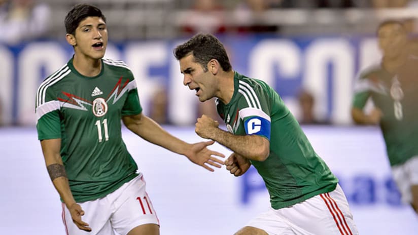 Mexico's Rafa Marquez celebrates his goal with Alan Pulido