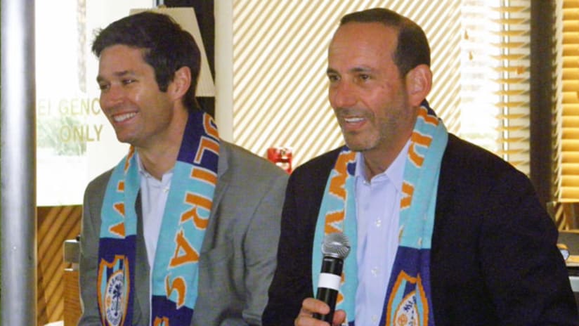 MLS Commissioner Don Garber (right) speaks with Miami soccer fans.