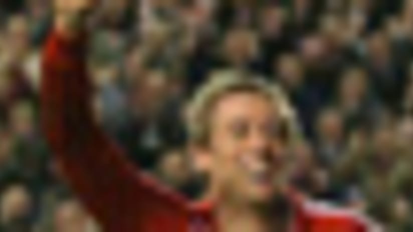Liverpool's Peter Crouch (L) celebrates after scoring a penalty shot vs. Porto with three minutes left.