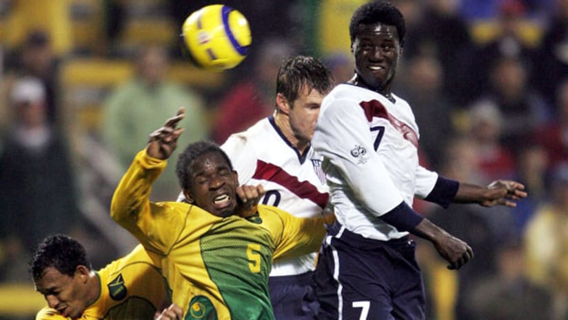Brian McBride, Eddie Johnson and the US face off against Tyrone Marshall and Jamaica in 2004.