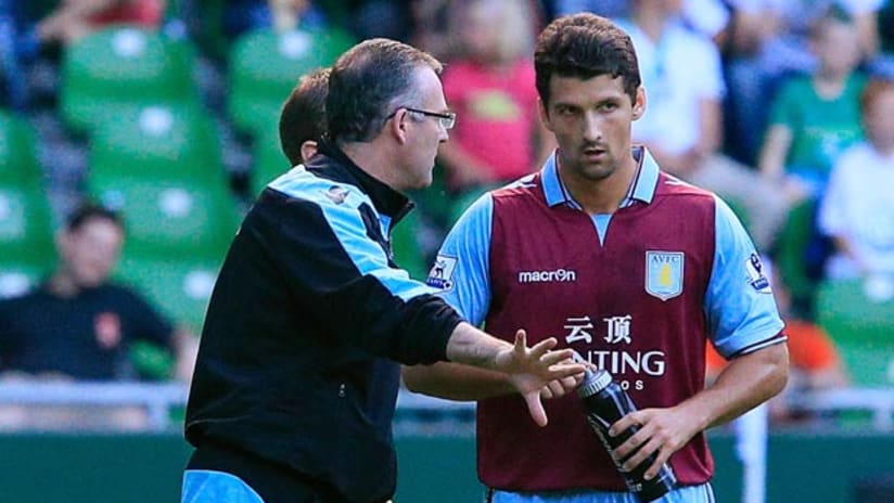 Eric Lichaj with Aston Villa manager Paul Lambert