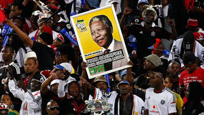 South African fans hold up a placard of Nelson Mandela