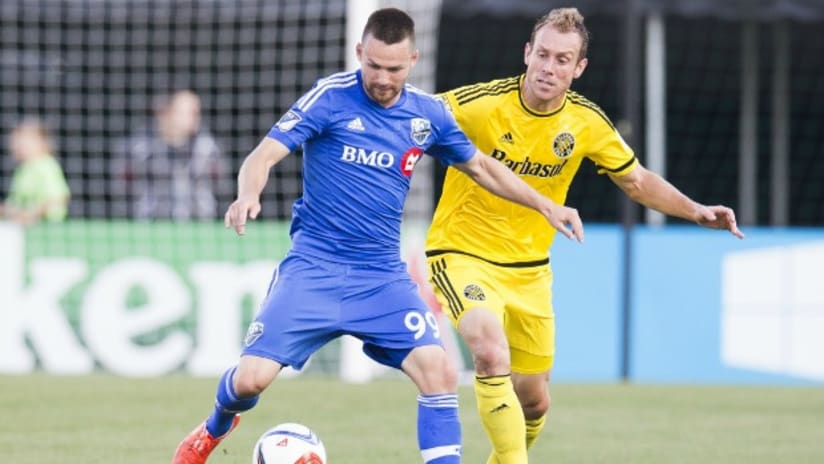 Montreal Impact's Jack McInerney battles with Columbus Crew SC's Tyson Wahl