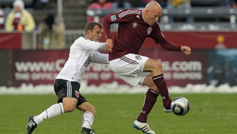 Conor Case of the Colorado Rapids controls the ball while under pressure from Daniel Woodlard of D.C. United on April 3, 2011.