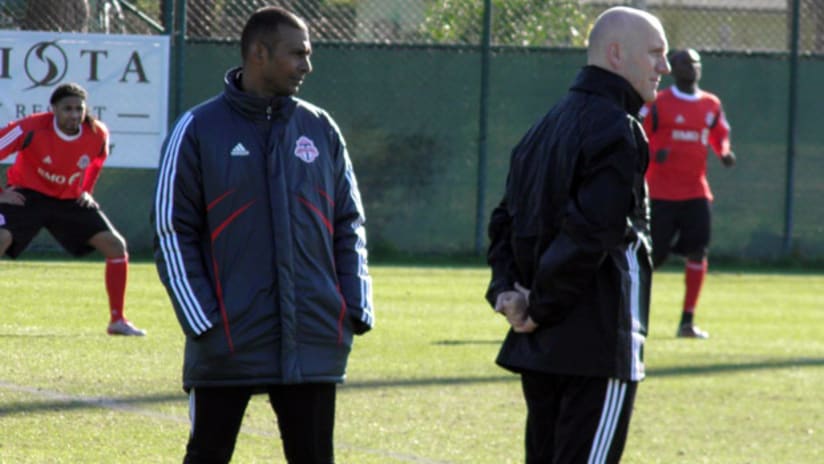 Toronto FC head coach Aron Winter and assistant coach Bob de Klerk oversee practice.