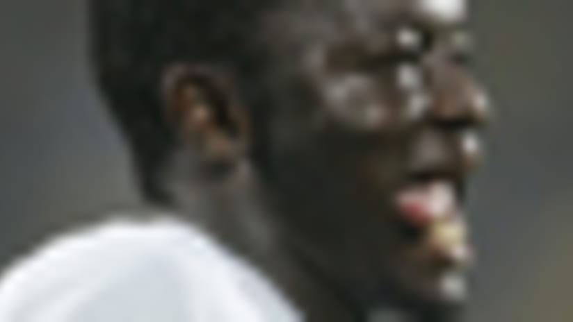 Ghana midfielder Sulley Muntari (top) urged teammates to come together to win the country's first title since 1982.