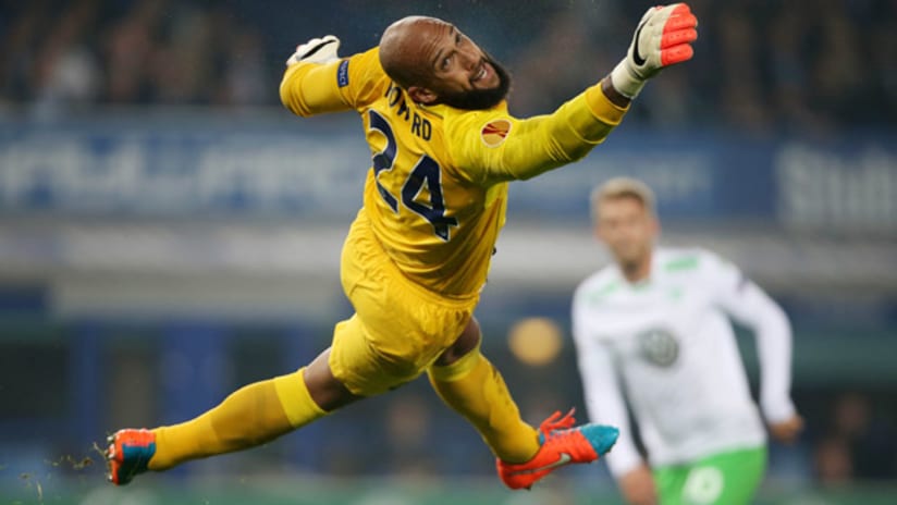 Tim Howard flies through the air in a game for Everton