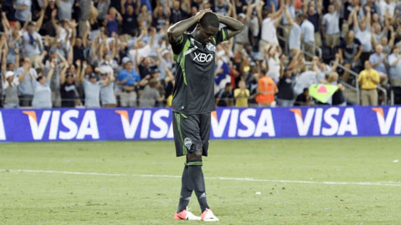 Eddie Johnson is dejected after missing his spot kick