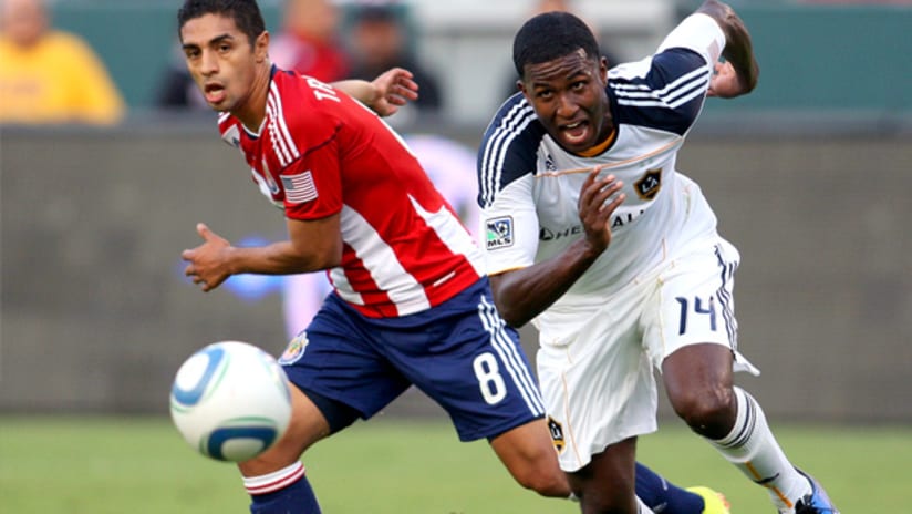Edson Buddle (right) and Mariano Trujillo fight for possession during LA's 2-1 victory over Chivas USA.