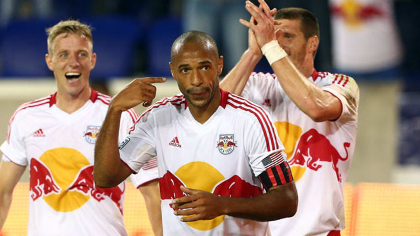 Thierry Henry celebrates his goal with teammates Kenny Cooper and Jan Gunnar Solli