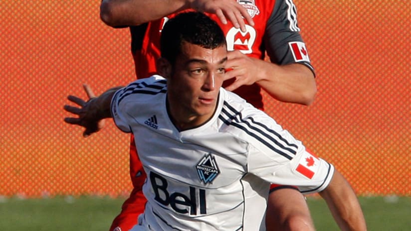 Russell Teibert goes up against Toronto FC