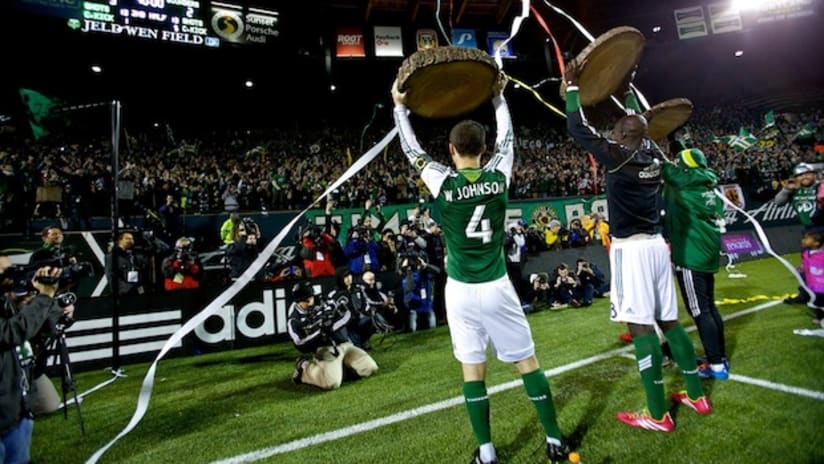 The Portland Timbers celebrate their win over Seattle with the Timbers Army