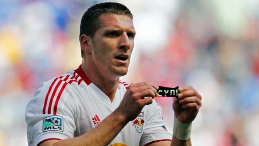 New York's Kenny Cooper shows off an armband honoring Jack Reyna