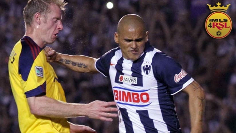Real Salt Lake's Nat Borchers and Monterrey's Humberto Suazo battle in the Champions League final first leg.