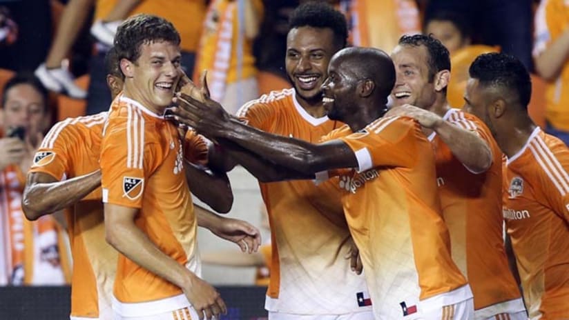 The Houston Dynamo celebrate a goal by Rob Lovejoy (left) in a win over the Montreal Impact