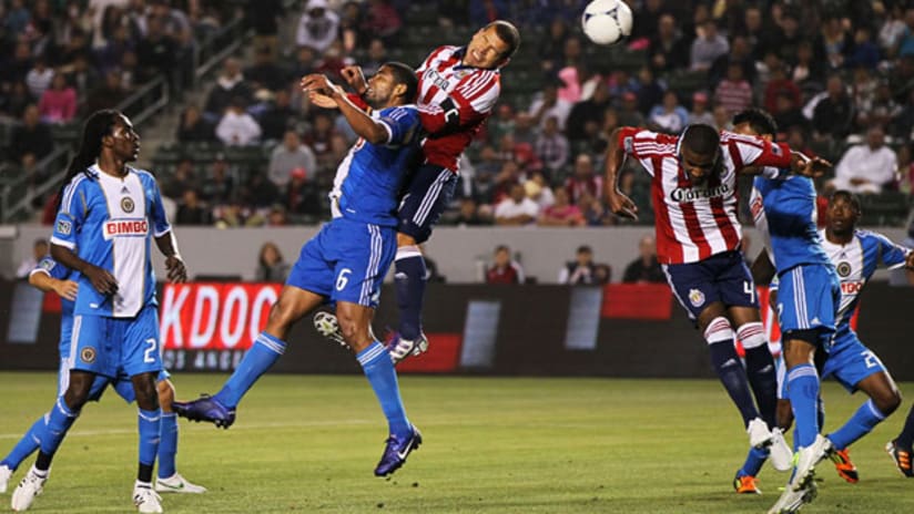 Chivas USA's Alejandro Moreno wins the header versus Philadelphia Union, April 21, 2012.