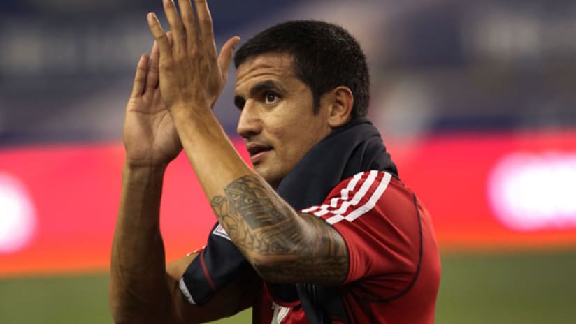 Red Bulls Tim Cahill claps as he leaves the field