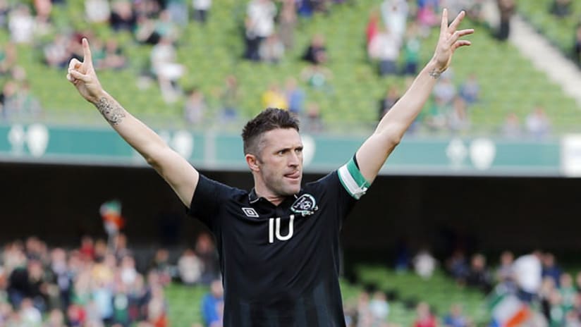 Robbie Keane celebrates his brace for Ireland