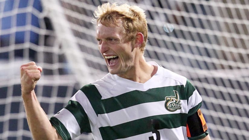 UNC Charlotte's Isaac Cowles celebrates his penalty kick on Creighton.