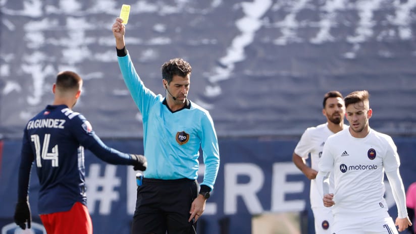 Fotis Bazakos - MLS referee - gives yellow card