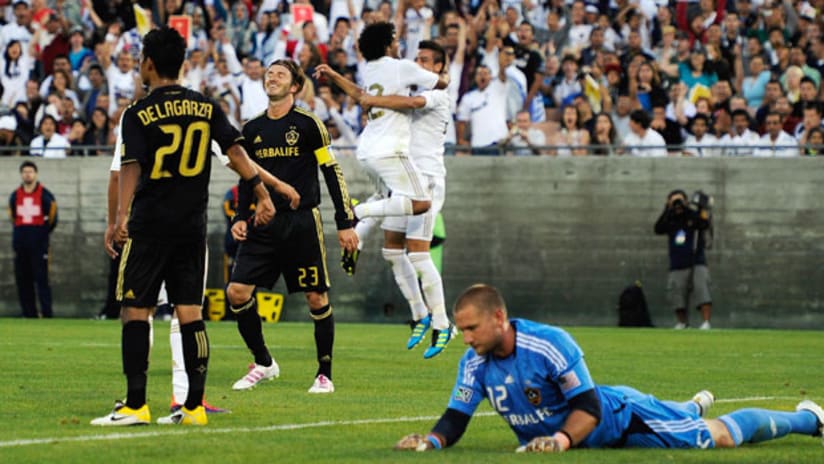 A.J. DeLaGarza and David Beckham react to Real Madrid's goal.