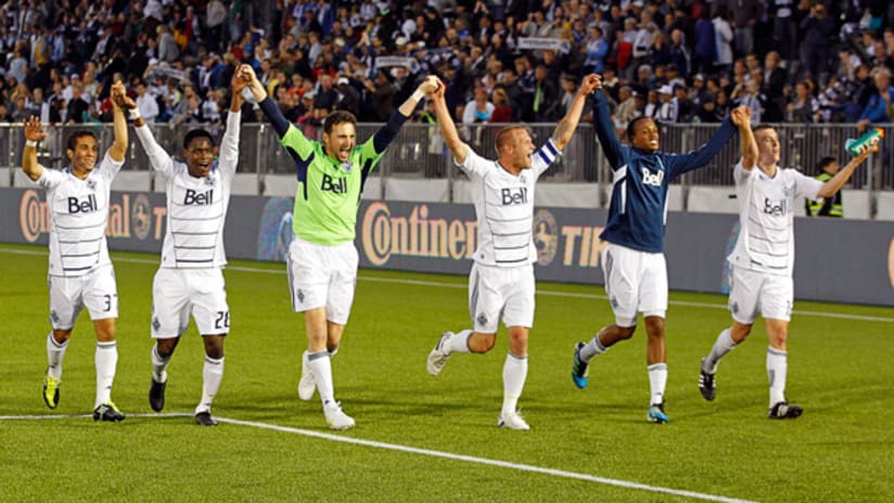 Whitecaps players celebrate their 1-0 win over the Union.