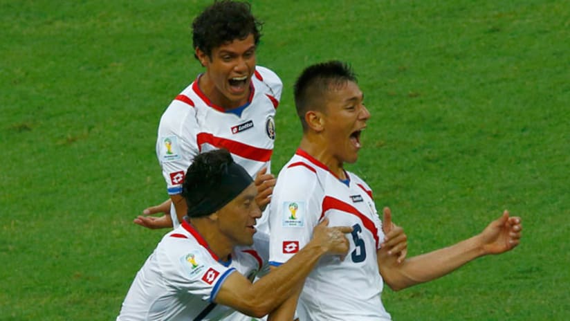 Costa Rica celebrate scoring the second goal against Uruguay