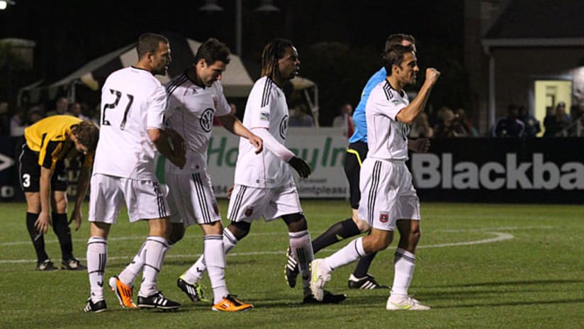 Josh Wolff celebrates a goal with his teammates as D.C. United beat the Charleston Battery.