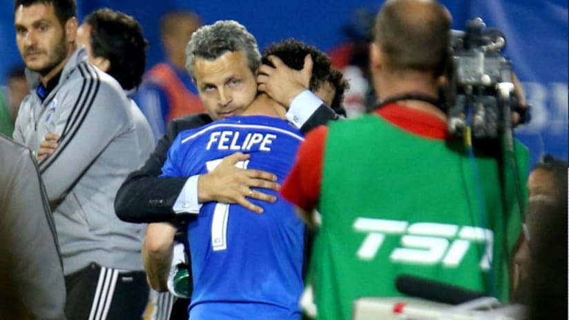 Head coach Frank Klopas of the Montreal Impact hugs Felipe