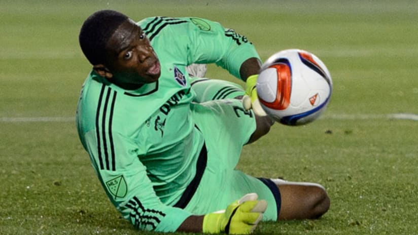 Chicago Fire goalkeeper Sean Johnson attempts to stop a shot