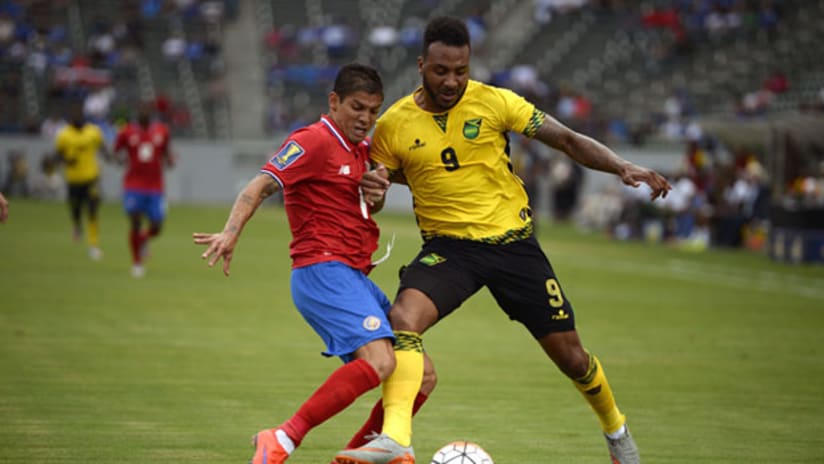 Giles Barnes of Jamaica and Christian Gamboa of Costa Rica in the Gold Cup