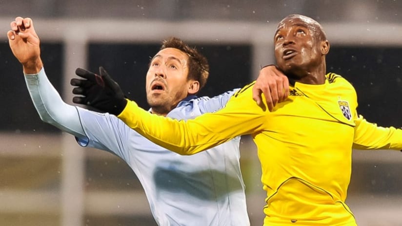 Davy Arnaud and Emmanuel Ekpo battle in the Crew's 1-0 win over Sporting KC