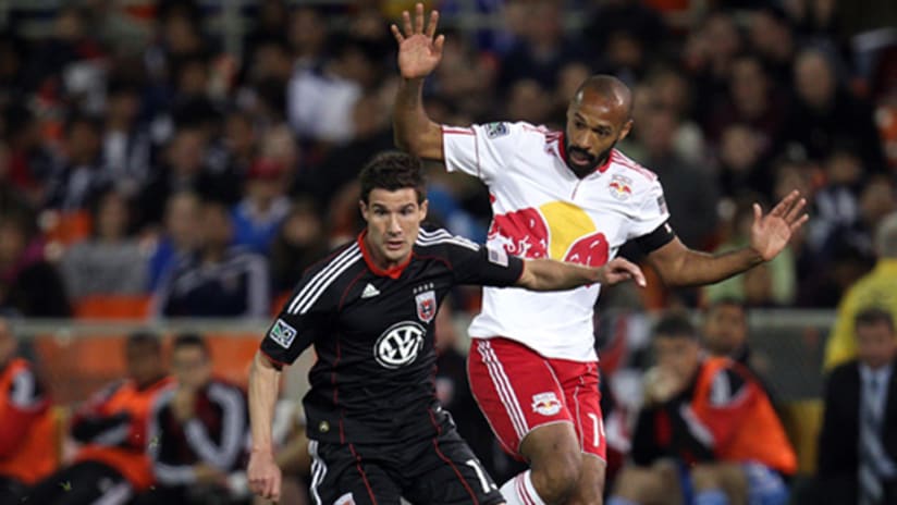 Chris Pontius battles with Thierry Henry