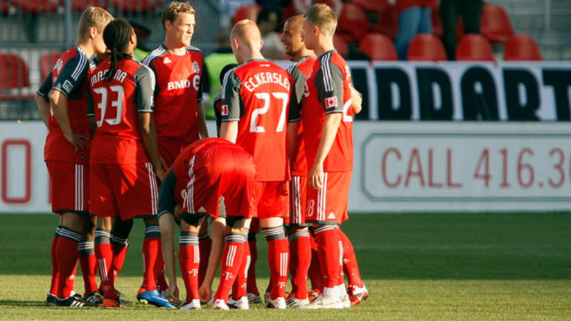 Toronto FC players huddle up before facing Vancouver.