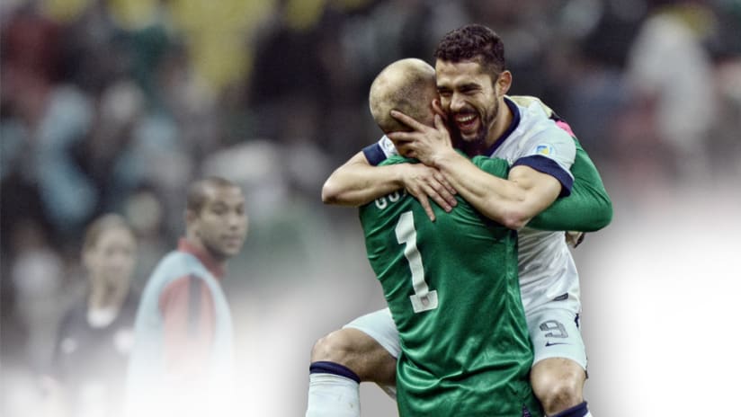 Herculez Gomez and Brad Guzan celebrate a draw at Estadio Azteca in World Cup qualifying