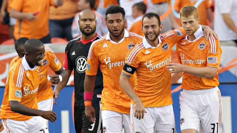 Members of the Houston Dynamo are all very excited to play sports.