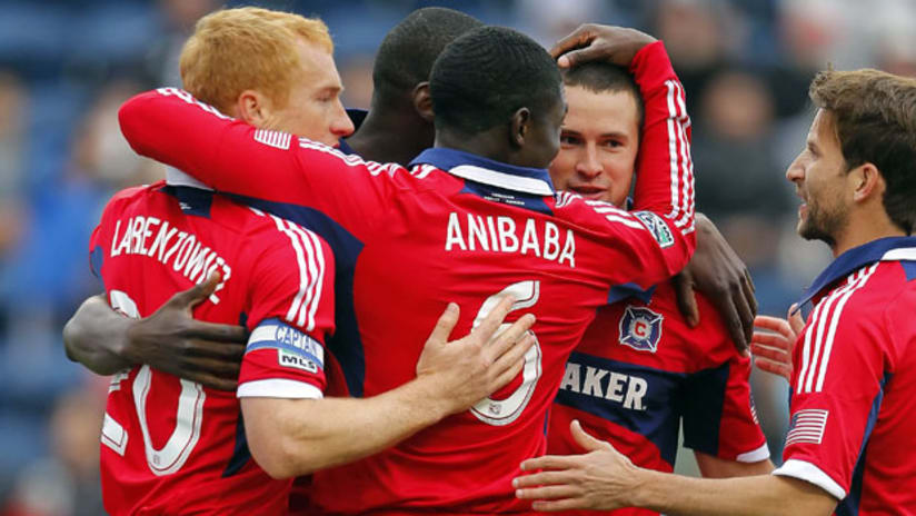 Jeff Larentowicz, Jalil Anibaba and the Chicago Fire celebrate a goal against D.C. United