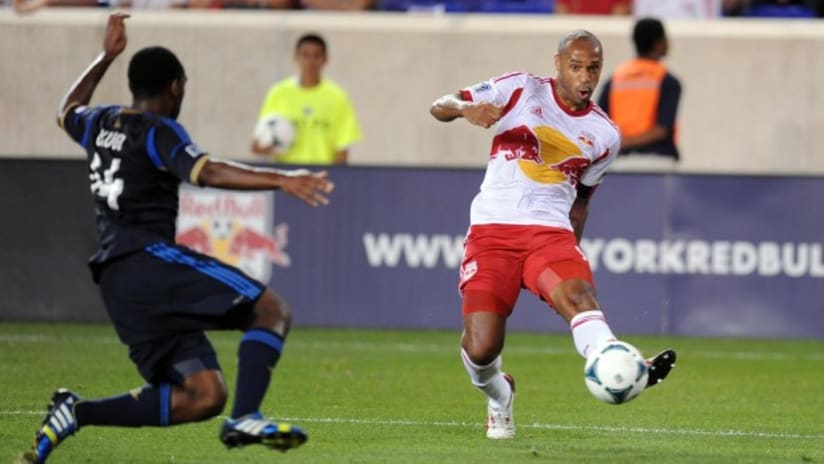 New York's Thierry Henry advances the ball on Philadelphia's Amobi Okugo