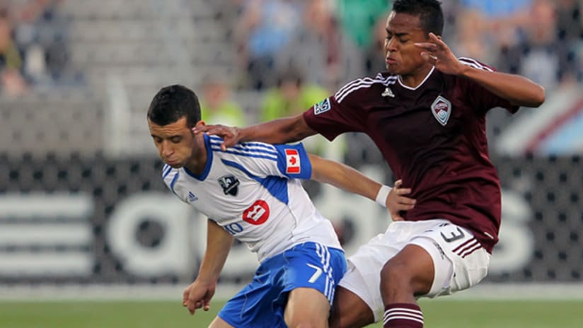 Montreal's Felipe (left) tussles with Colorado's Jaime Castrillon for possession.