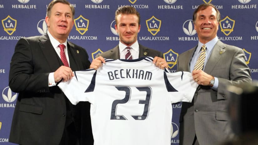 Tim Leiweke, David Beckham and Bruce Arena of the Los Angeles Galaxy present Beckham with his new jersey