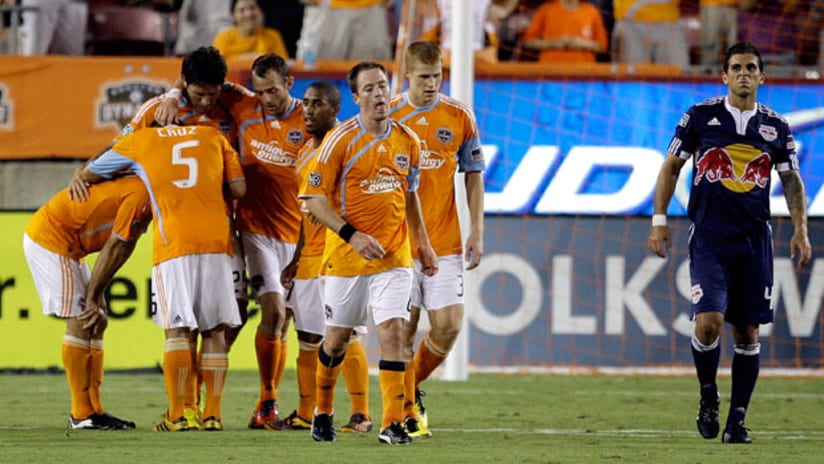 Houston Dynamo players celebrate Brian Mullan's equalizing goal against the Red Bulls on Saturday night at Robertson Stadium.