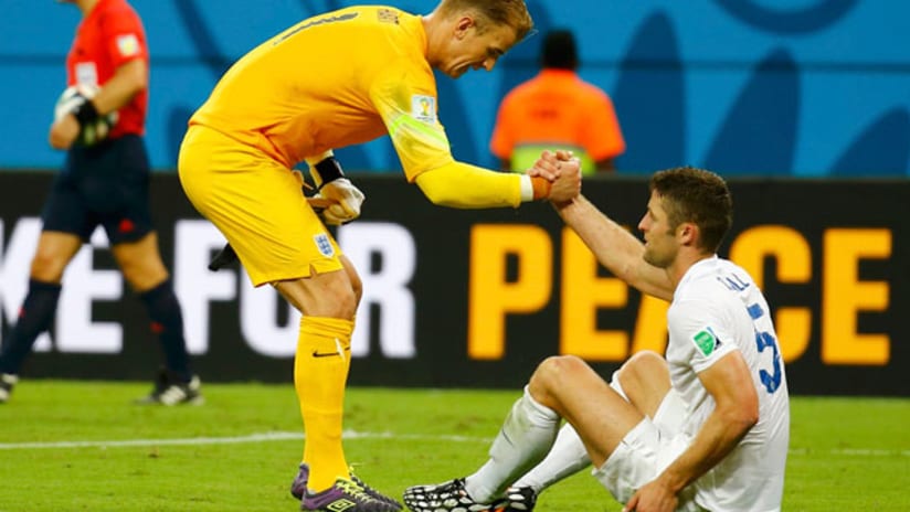 Joe Hart helps Gary Cahill up off the ground in Manaus (June 14, 2014)
