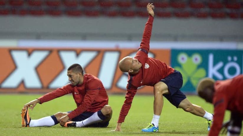 Clint Dempsey and Michael Bradley stretch together before USMNT game