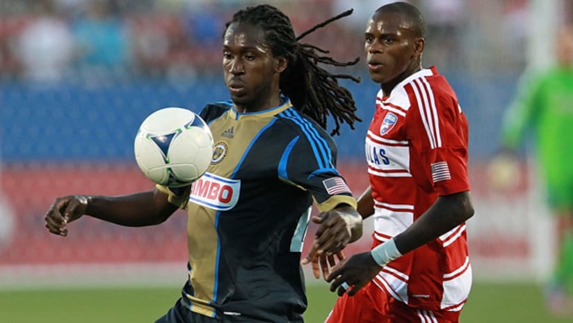 Philly's Keon Daniel controls the ball as FCD's Jackson closes in